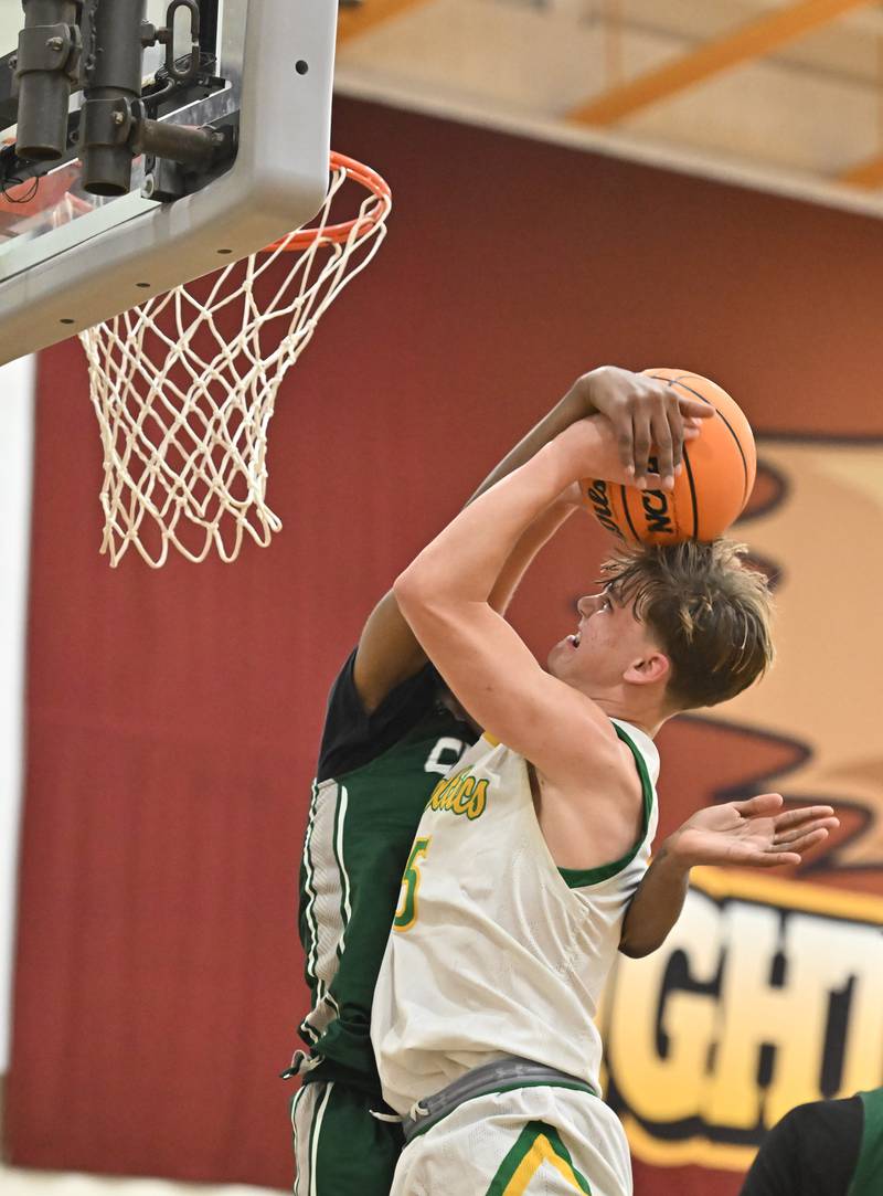 Providence Catholic's Eli Phillips (5) goes up strong for a shot during the WJOL tournament game against Plainfield Central on Friday, NOV. 28, 2025, at Joliet.