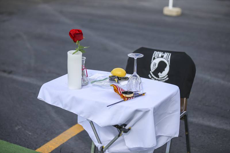 A fallen soldier table at the Vietnam Traveling Memorial Wall display, Thursday, Aug 21, 2025  in Romeoville.