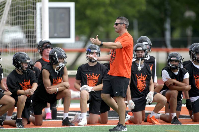 St. Charles East Head Coach Nolan Possley talks to his team during the first day of practice for the fall season on Monday, Aug. 7, 2023 at the school.