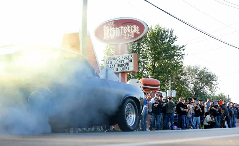 A Chevy Nova does a burn out during the Kick off Cruise on Saturday, April 25, 2026 at Root Beer Stand in Oglesby. Donations from the cruise helped fund the Kids Hot Rod Camp held June 15-19 at "The Rock" Walnut Community Bible Church in Walnut. The camp is open to kids ages 12-17.