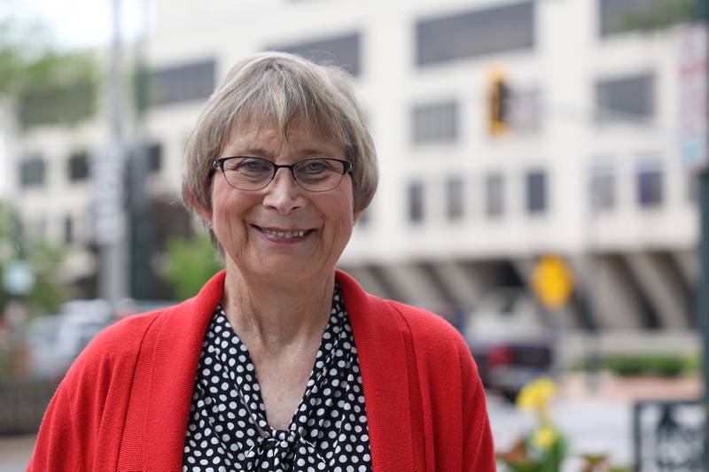 Kelly Sullivan, recently retired Will County State's Attorney's Office Victim Witness Advocate, poses in front of the old Will County Courthouse were she started 35 years ago in an office on the 2nd floor.