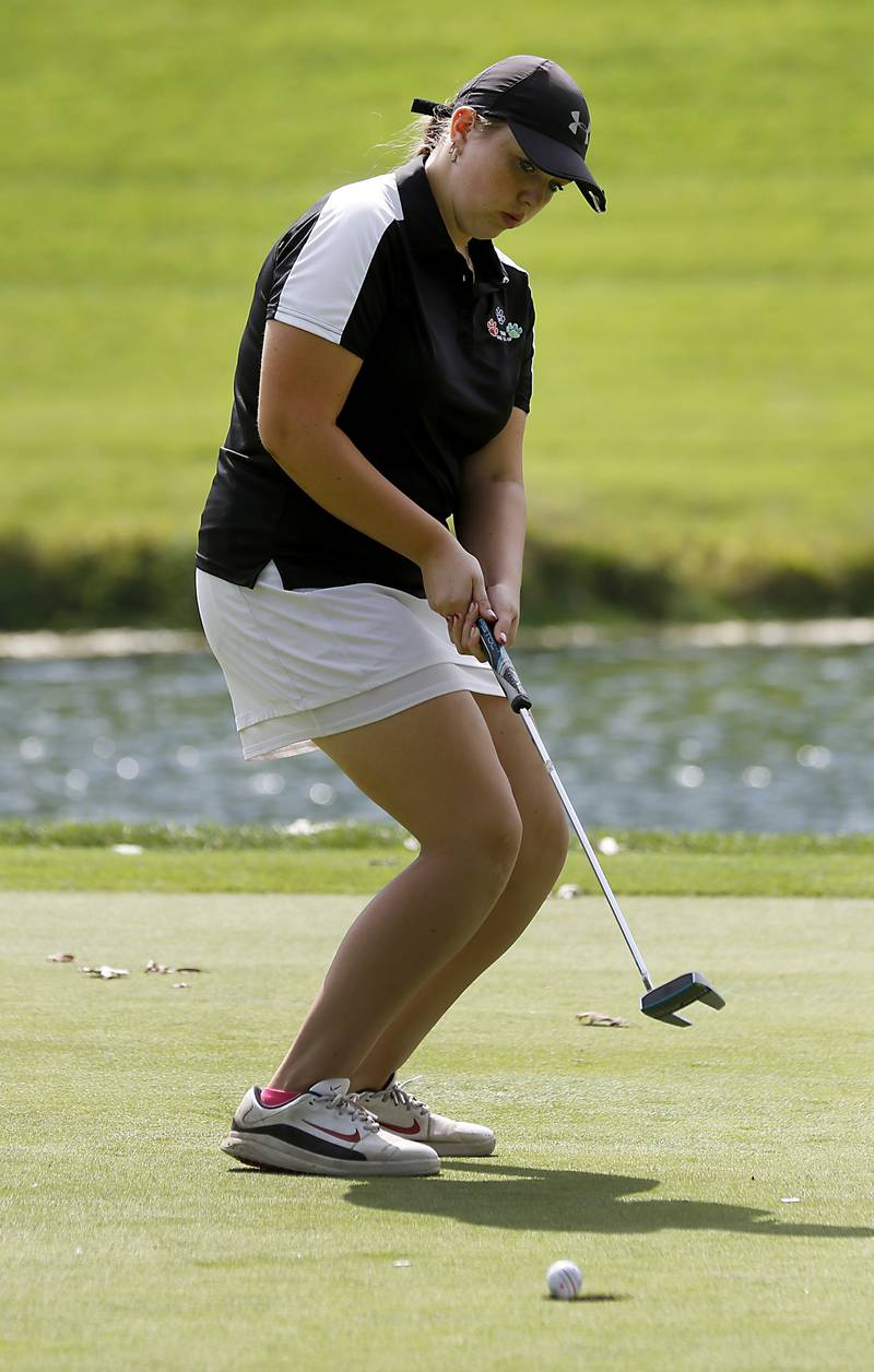 Crystal Lake Co-op’s Delaney Medlyn uses some body English as she makes a putt on the 12th green during the Fox Valley Conference Girls Golf Tournament Wednesday, Sept. 21, 2022, at Crystal Woods Golf Club in Woodstock.