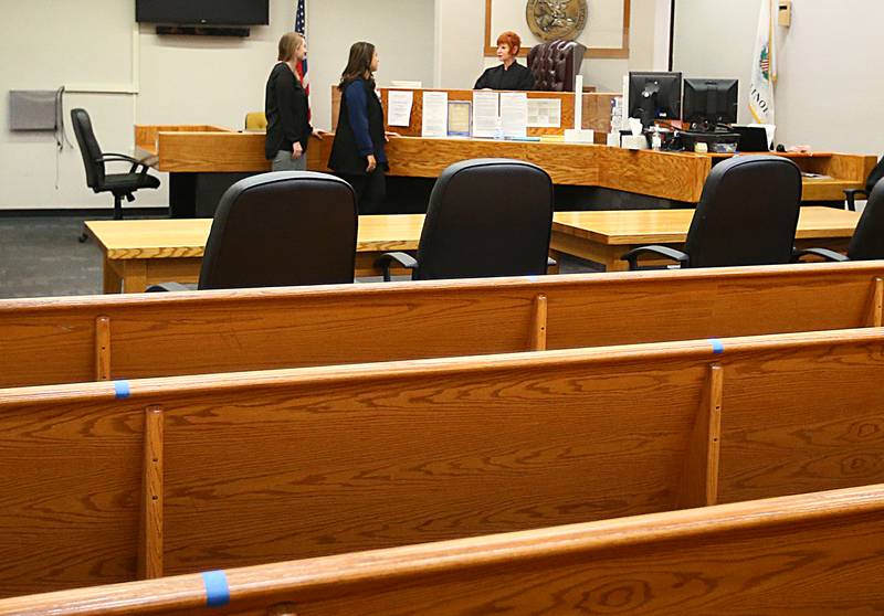 Judge Cynthia Raccuglia, speaks with drug court coordinators Maranda Johnson and Selenia Arteaga in the courtroom on Wednesday Nov. 3, 2021 at the La Salle County Government Complex in Ottawa. The program began in April 2020. The program currently has six individuals that are enrolled. To qualify for the drug court program, you need a referral from an attorney and be convicted of a specific felon. In addition, there is a drug court act that clarifies what is acceptable and what isn’t. A risk assessment is also conducted. The program is grant funded.