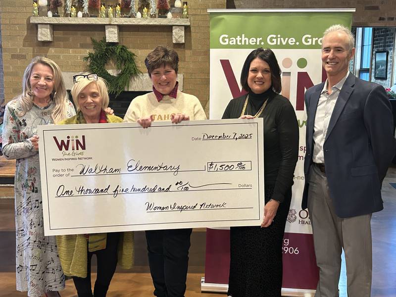 Starved Rock County Community Foundation founder Pamela Beckett (from left), Women Inspired Network grants chair Debbie Buffington, Waltham Elementary School teacher Kathleen Diluciano, Women Inspired Network steering committee co-chair Cherie Reynolds, and Starved Rock County Community Foundation CEO Fran Brolley