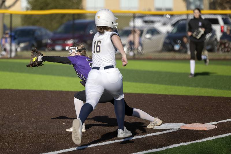 Dixon’s Ayden Kinn makes a catch at first for an out against Sterling’s Breanna Taylor Tuesday, March 25, 2025.