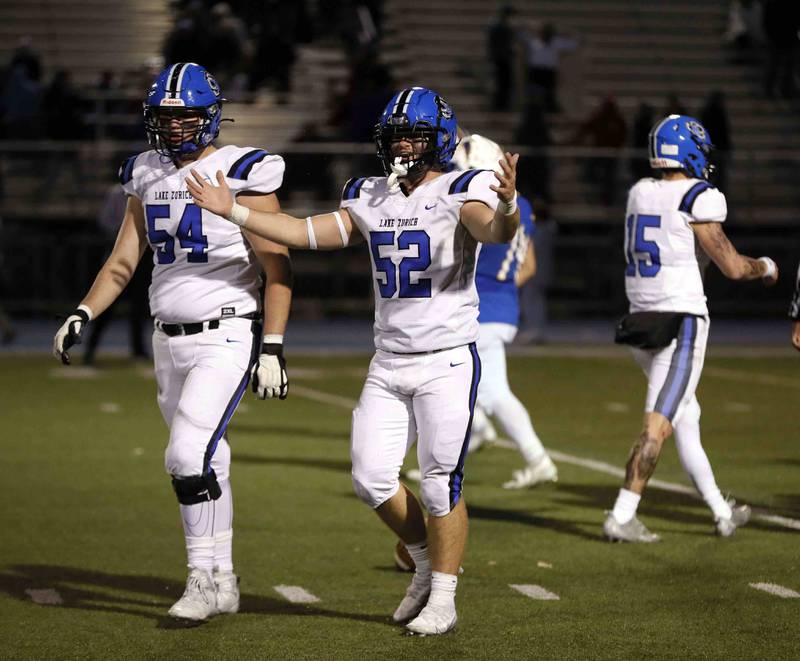 Brian Hill/bhill@dailyherald.com
Lake Zurich players celebrate as they beat Wheaton North during the second round of the IHSA playoffs Saturday November 5, 2022 in Wheaton.