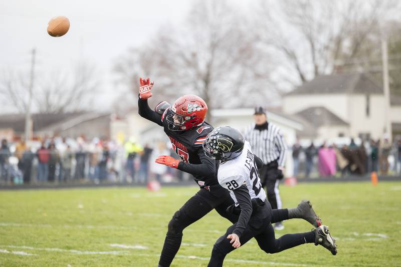 A pass is out of reach of Fulton’s Ethan Price while being covered by Le/Win’s Nick Tippett Saturday, Nov. 12, 2022.