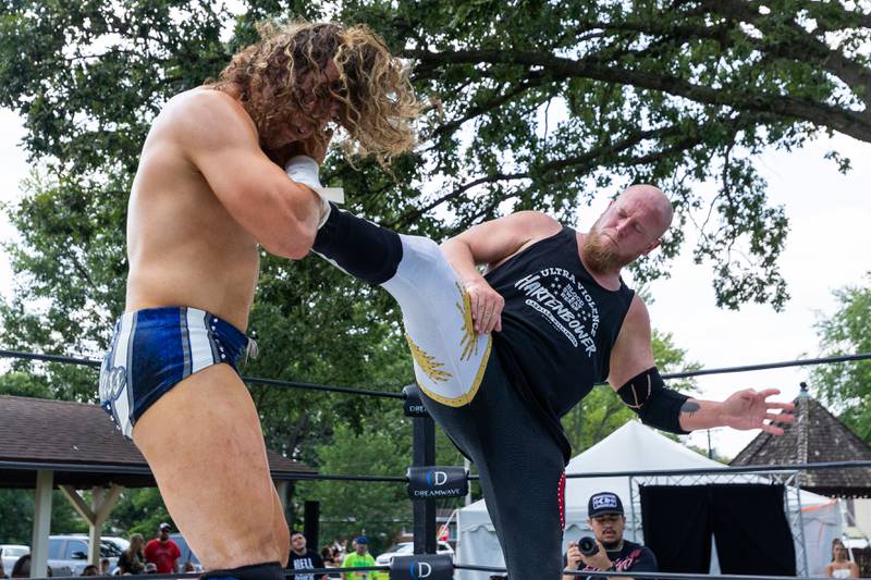 (left to right) Channing Thomas gets super kicked by Hartenbower at the Taste of the Illinois Valley DreamWave Wrestling event on Saturday, August 2, 2025 at Centennial Park in Peru.