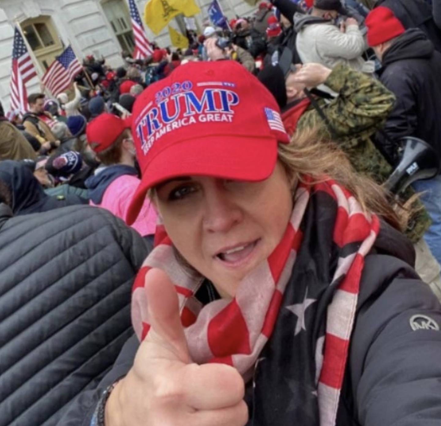 Kelly Lynn Fontaine "celebrated amidst the chaos outside the Senate Wing Door," on Jan. 6, 2021, according to federal prosecutors. The photo was filed in a sentencing memorandum by prosecutors in the case against Fontaine and her husband, Bryan Dula.