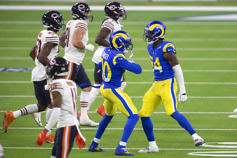 Los Angeles Rams linebacker Leonard Floyd (54), right, and cornerback Jalen Ramsey (20) celebrate Floyd's sack during an NFL football game against the Chicago Bears Monday, Oct. 26, 2020, in Inglewood, Calif.