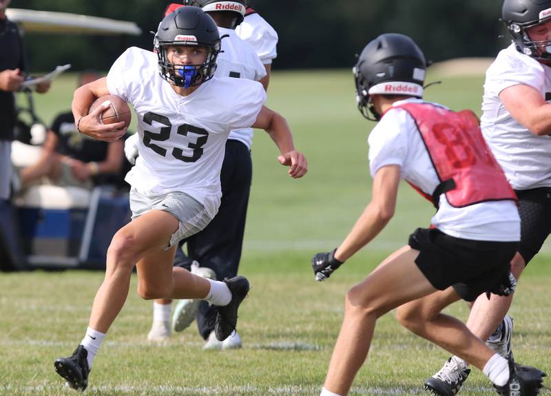 Sycamore’s Dylan Hodges carries the ball during practice Monday, Aug. 7, 2023, at Sycamore High School.
