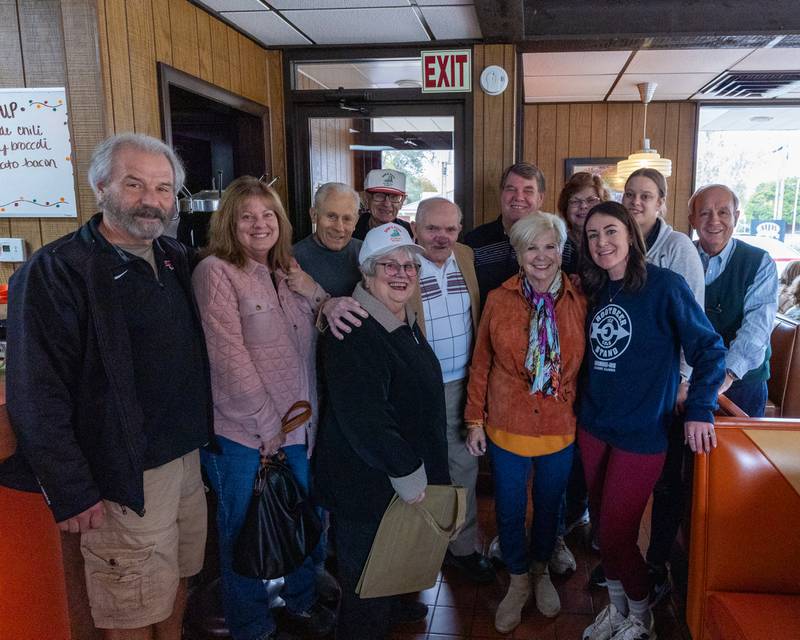 Friends and family pose for photo with Sam Leone at Sam’s retirement celebration on Saturday, October 25, 2025 at the Rootbeer Stand in Oglesby.