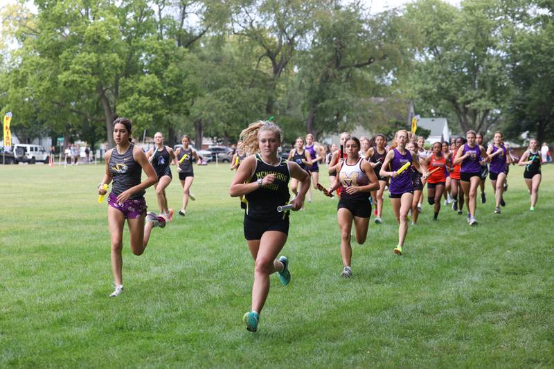 Bishop McNamara's Izzy Wilkey, center, strides out to secure a leading position during the Irish Conditioner at Small Memorial Park in Kankakee on Wednesday, Sept. 3, 2025.