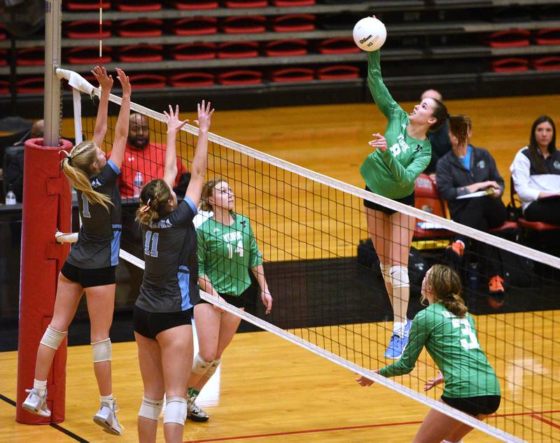 York's Emelyn Stettin (8) hits into the Willowbrook ddefense during Monday's Proviso West Class 4A girls sectional volleyball match in Hillside.