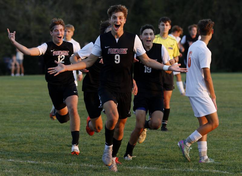 Prairie Ridge's Henry Knoll celebrates  his goal during a Fox Valley Conference soccer match against Crystal Lake Central on Thursday, Oct. 10, 2024, at Prairie Ridge High School.