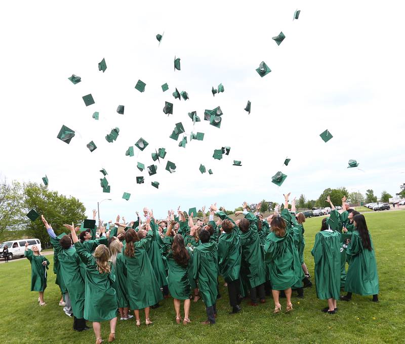 St. Bede Class of 2022 graduates throw their caps after graduation on Sunday, May 15, 2022 at St. Bede Academy in Peru. 84 graduates were present for the 130th annual commencement ceremony.