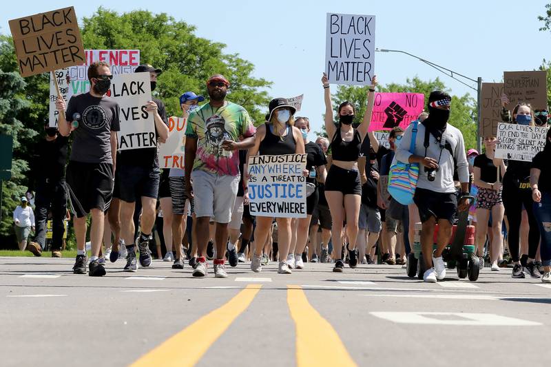 More than a hundred protesters took a stand against racism and the social injustices faced by African Americans across the country during a peaceful Black Lives Matter protest on Saturday, June 6, 2020 in Cary. The group rallied at the intersection of Montana Dr. and Pearl St. and marched through neighborhoods to Cary-Grove High School.
