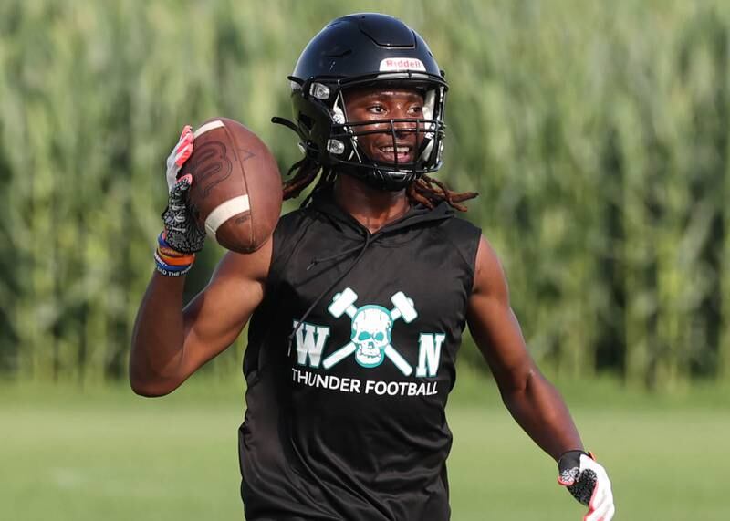 Woodstock North’s Max Dennison throws the ball back to teammates after making a catch Tuesday, July 16, 2024, during their matchup with DeKalb in the Kaneland 7-on-7 at the school in Maple Park.