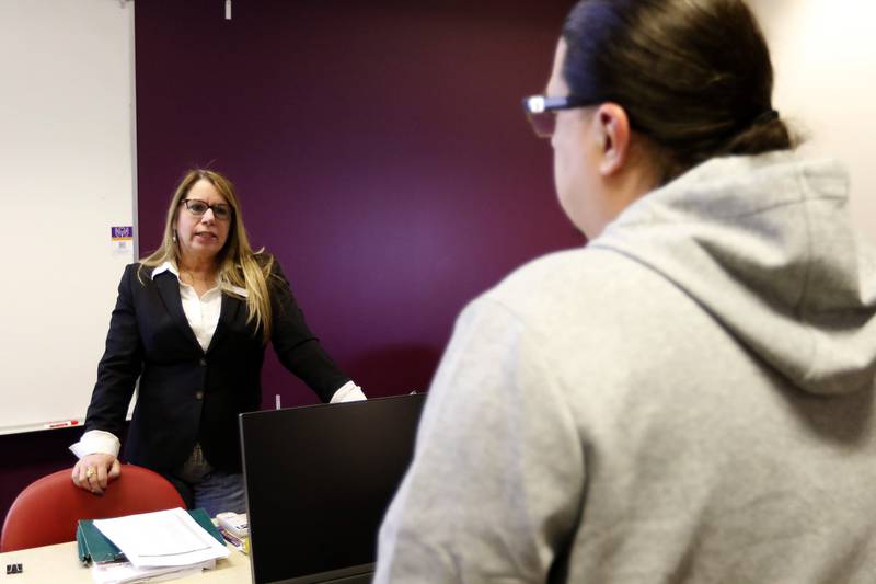 Robin Berry, an attorney and the Chair of the Paralegal Department at McHenry County College, talks with a student on Wednesday, April 16, 2025, at the college in Crystal Lake.