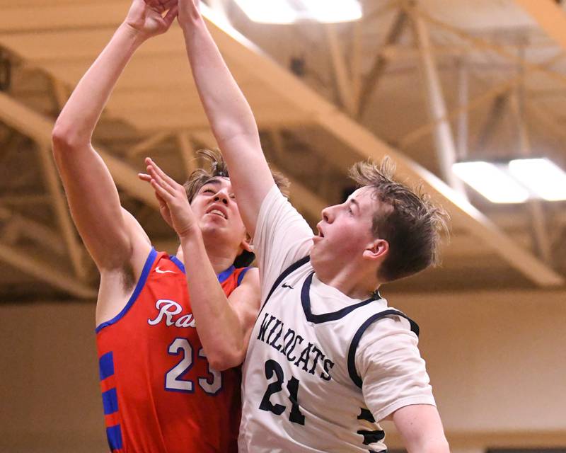 Glenbard South's Joey Villa (23) makes a basket while being defended by West Chicago's defender Ryan Slattery (21) during the game on Friday Jan. 3, 2025, held at West Chicago High School.
