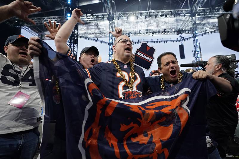 Chicago Bears fans cheer during the second round of the NFL Draft, Friday, April 28, 2023, in Kansas City, Mo.