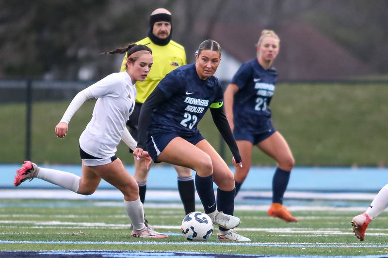 Downers Grove South's Ashley Molinari (23) dribbles the bal during soccer match between Riverside-Brookfield at Downers Grove South.  April 10, 2025.