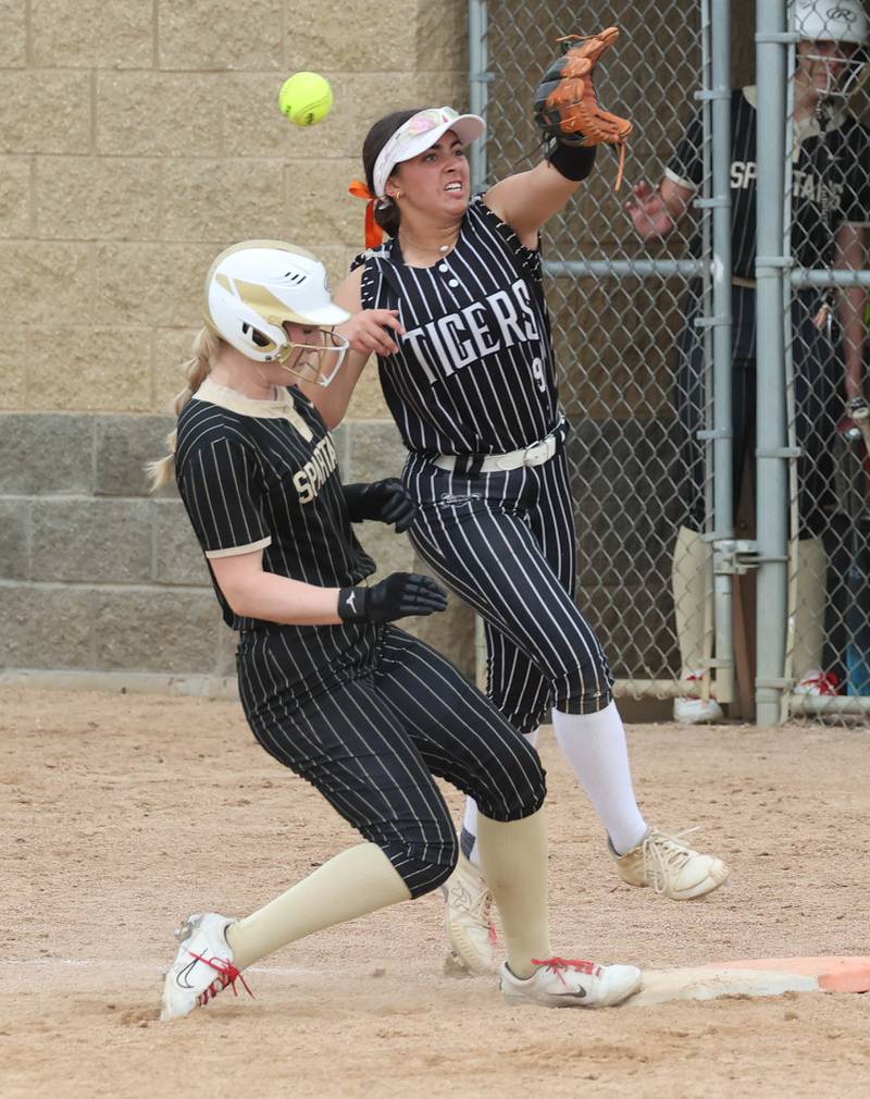 Sycamore's Ellison Hallahan goes back to first as the ball gets by Crystal Lake Central's Adi Waliullah Tuesday, June 3, 2025 during their Class 3A sectional semifinal game at Sycamore High School. Hallahan advanced to second on the error.