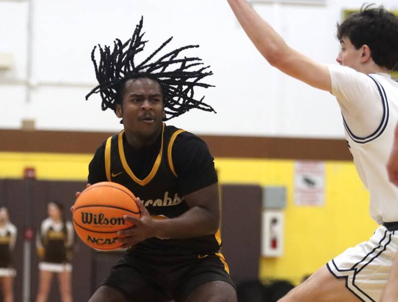 Jacobs’ Emaan Thomas moves the ball against Cary-Grove during Hinkle Holiday Classic varsity boys basketball tournament action on Thursday, Dec. 26, 2024 at Jacobs High School in Algonquin.