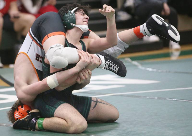 St. Bede's Andre Pineda wrestles Sandwich's Josh Lehman in the 157 pound weight class during the Class 1A Regional meet on Saturday, Feb. 8, 2025 at St. Bede Academy.