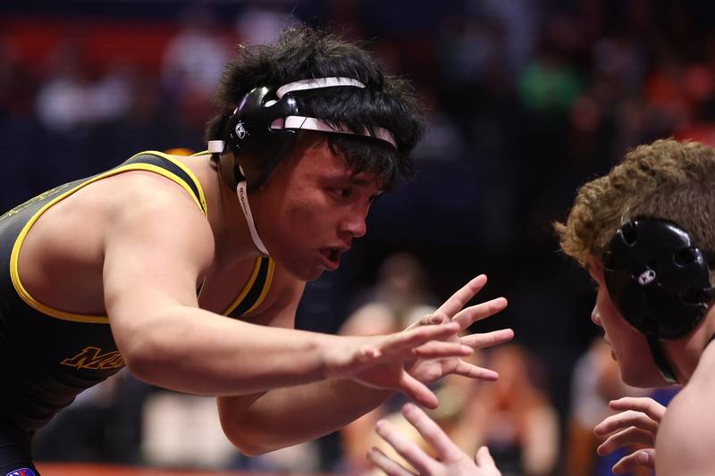 Montini’s David Mayora works against Aurora Christian’s Braden Stauffenberg in the Class 2A 152lb. semifinals at State Farm Center in Champaign. Friday, Feb. 18, 2022, in Champaign.