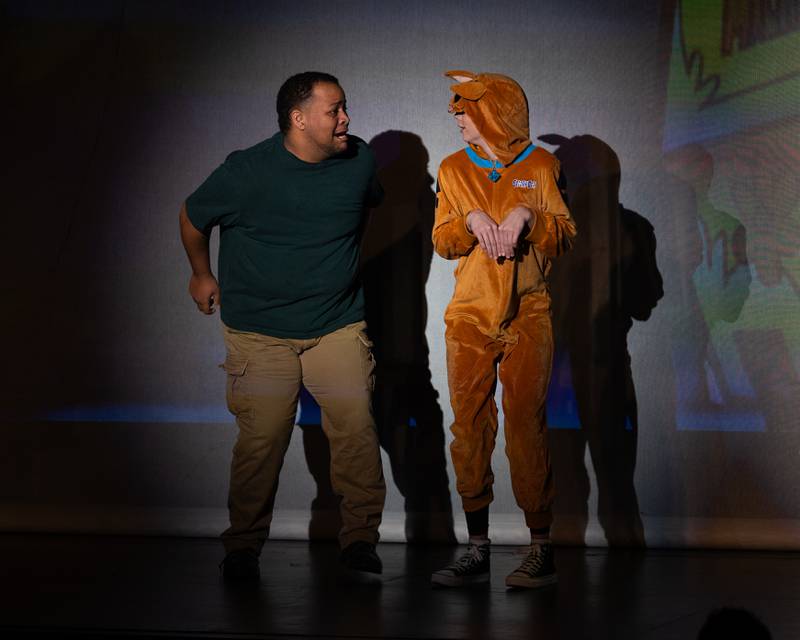 'Shaggy' (portrayed by Fredrick Davis) and 'Scooby' (portrayed by Holly Malmassari) hide from 'ghost' during performance of "New Year, New Friends" on Saturday, December 27, 2025 at Stage 212 in LaSalle.