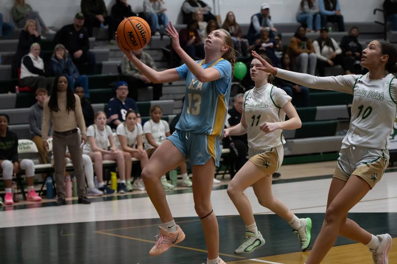 Joliet Catholic's Abby Dulinsky goes for a layup during their game against Bishop McNamara on Wednesday, Feb. 11, 2026.