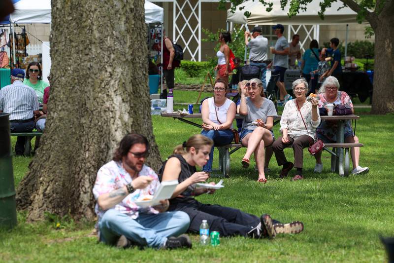 Attendees eat food and listen to live music during the 36th annual Rhubarb Festival at the Kankakee County Museum on Sunday, May 17, 2026.