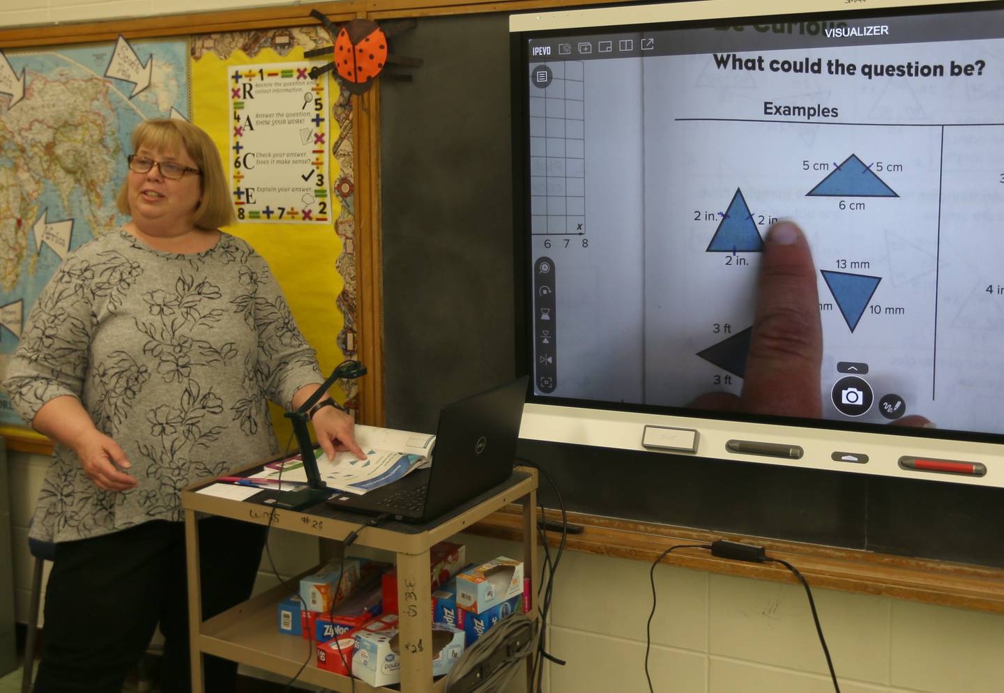 Anne Devert teaches math to students on Thursday, April 20, 2023, at Logan Jr. High School in Princeton.