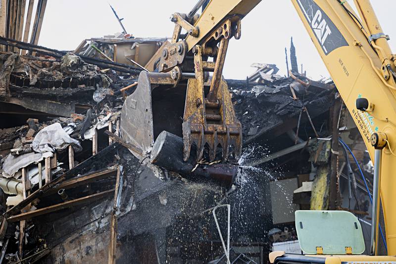 A water heater gives up its good during the demolition Tuesday, Sept. 5, 2023.