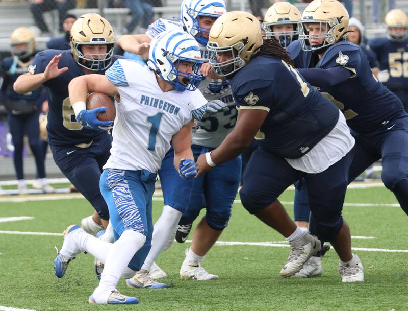 Princeton's Casey Etheridge runs the ball against Central Catholic during the Class 3A playoffs on Saturday, Nov. 1, 2025 at Central Catholic High School in Bloomington.