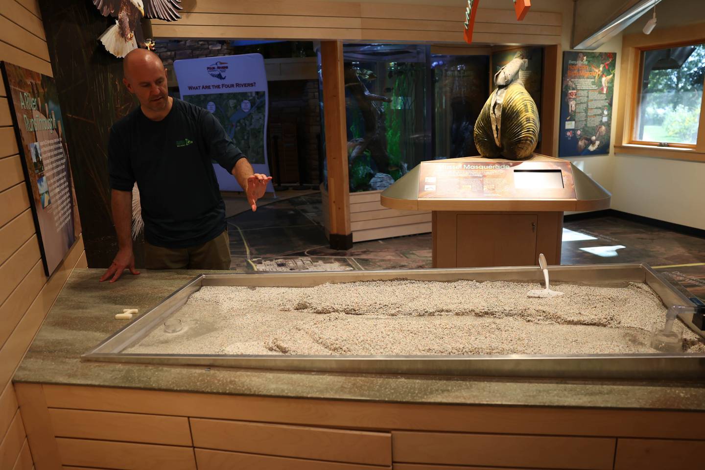 Jerome Gabriel Four Rivers Environmental Center Facility Supervisor demonstrates land erosion on the new stream table. Tuesday, Sept. 20, 2022, in Channahon.