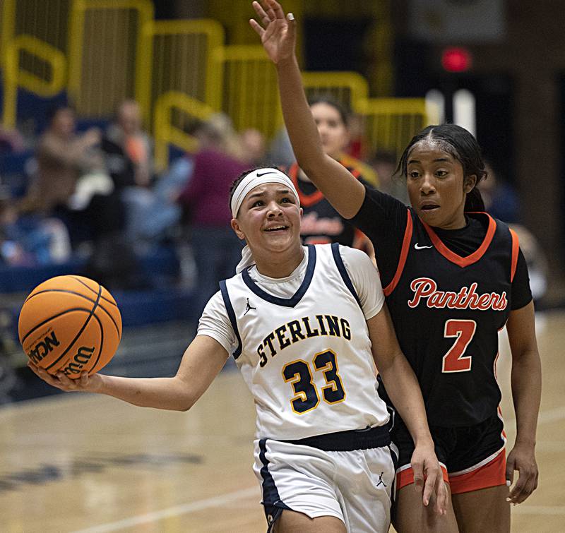 Sterling’s Joslynn James puts up a shot against UT’s Remaz Adam Thursday, Feb. 6, 2025, at Sterling High School.