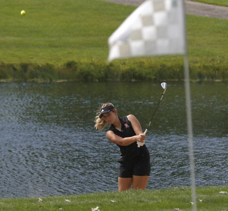 McHenry’s Madison Donovan chips onto the 12th green during the Fox Valley Conference Girls Golf Tournament Wednesday, Sept. 21, 2022, at Crystal Woods Golf Club in Woodstock.