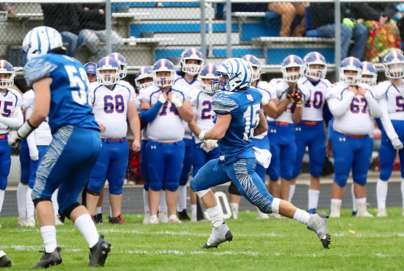 Princeton's Augie Christiansen (15) gets loose against Genoa-Kingston in Saturday's 3A Playoff at Bryant Field.