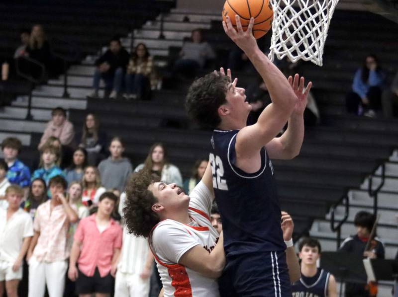 McHenry’s Josiah Kordik, left, guards Cary-Grove’s  Adam Bauer under the hoop in varsity boys basketball on Tuesday, Feb. 17, 2026, at McHenry High School in McHenry.