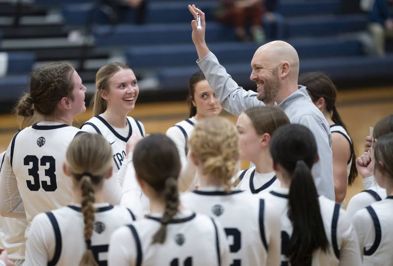 Cary-Grove head coach Tony Moretti celebrates with his team after defeating Lake Forest during the Class 3A Cary-Grove Regional Girls Basketball Championship game on Thursday, February 20, 2025 in Cary. Ryan Rayburn for Shaw Local