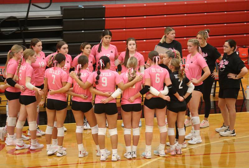 Members of the Hall volleyball team huddle during a time out on Thursday, Oct. 9, 2025 at Hall High School.