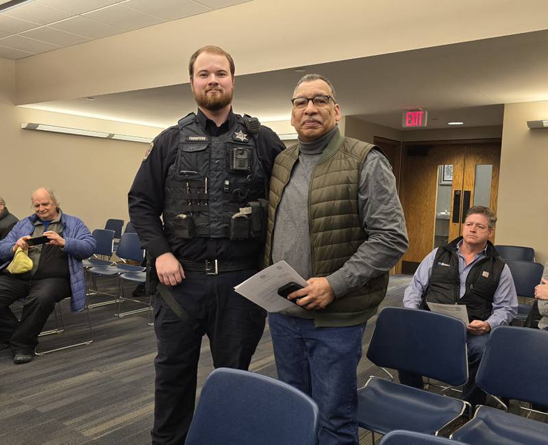 Officer John Thompson had just a minute during his shift to stop into the Streator City Council on Wednesday, Feb. 19, 2025, and receive an applause for his work in apprehending two suspects. He is pictured (on the left) with Police Chief John Franklin.
