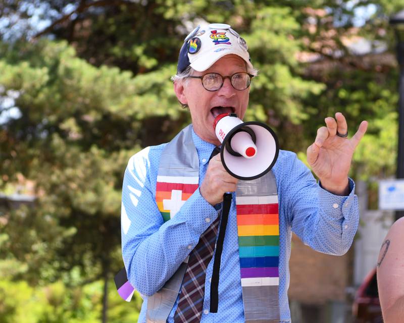 The Rev. John Dorhauer of First Congregational Church in DeKalb speaks in support of transgender people and rights during a Trans Resilience Rally held on Sunday, June 22, 2025, in downtown DeKalb. Organizers said the rally was to show public support for people they believe are unjustly and harmfully targeted under President Donald Trump's policies.