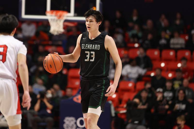 Glenbard West’s Bobby Durkin works the ball at the top of the key against Bolingbrook in the Class 4A semifinal at State Farm Center in Champaign. Friday, Mar. 11, 2022, in Champaign.