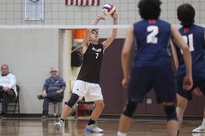 Joliet Catholic’s Patrick Duncan-Abushalback sets the ball against St. Viator on Wednesday, April 24, 2024 in Joliet.