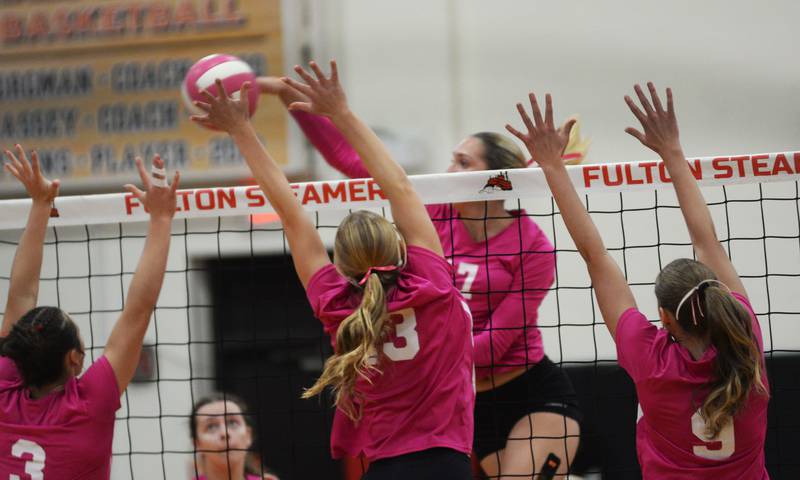 Eastland's Trixie Carroll tries to direct the ball past three Fulton blockers Kerby Germann (3), Haley Smither (13), and Jessa Read (9) on Tuesday, Oct. 7, 2025 in Fulton.