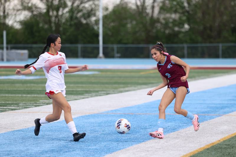 Kankakee's Guadalupe Hernandez sends the ball forward under pressure during the Kays' 5-0 win against Blue Island Eisenhower in the Class 2A Kankakee Regional semifinals on Tuesday, May 19, 2026.