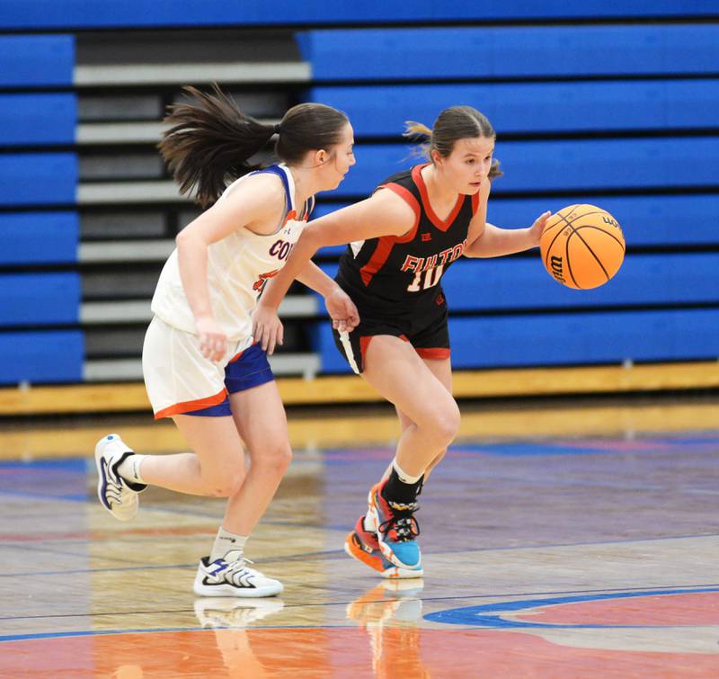 Fulton's Wrenn Coffey (10) dribbles as Eastland's Sienna Peterson (22) defends during a Friday, Dec. 13, 2024 game at Eastland High School in Lanark.